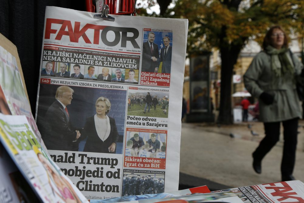 This was the America that welcomed me as a teenager, never cared where I was from, and never made me feel like I was an outsider, writes Ismar Volić. Pictured: Bosnian people passes by daily newspapers with photos of President-elect Donald Trump published in newspaper, in Sarajevo, Bosnia, on Wednesday, Nov. 9, 2016. (Amel Emric/AP)