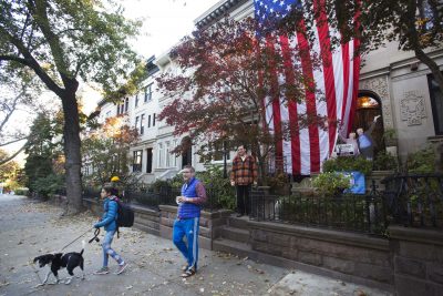 David McGovern, right, watches as his husband, Steven Pollack, walks their daughter, Claire, to school, Monday, Nov. 7, 2016, in the Brooklyn borough of New York. (Mark Lennihan/AP)