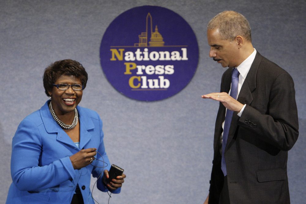 In this file photo, Attorney General Eric Holder talks with Gwen Ifill during a NAACP Legal Defense and Educational Fund luncheon. Ifill died Monday, November 14 2016 at the age of 61. (Alex Brandon/AP)