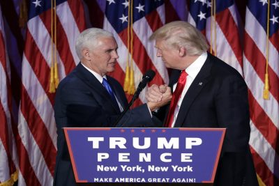 President-elect Donald Trump shakes hands with Vice President-elect Mike Pence as he gives his acceptance speech during his election night rally,. (John Locher/AP)