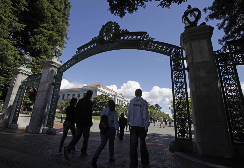 A group of students walk through the Sather Gate on the University of California, Berkeley campus in Berkeley, Calif., in August 2011. (Eric Risberg/AP)