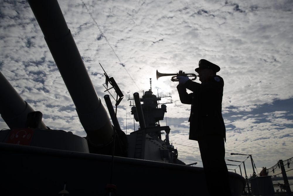 Greg Murphy plays the Navy Hymn during a ceremony commemorating the 75th anniversary of the Dec. 7, 1941 Japanese attack on Pearl Harbor, on board The Battleship New Jersey Museum and Memorial in Camden, N.J., Wednesday, Dec. 7, 2016. (Matt Rourke/AP Photo)