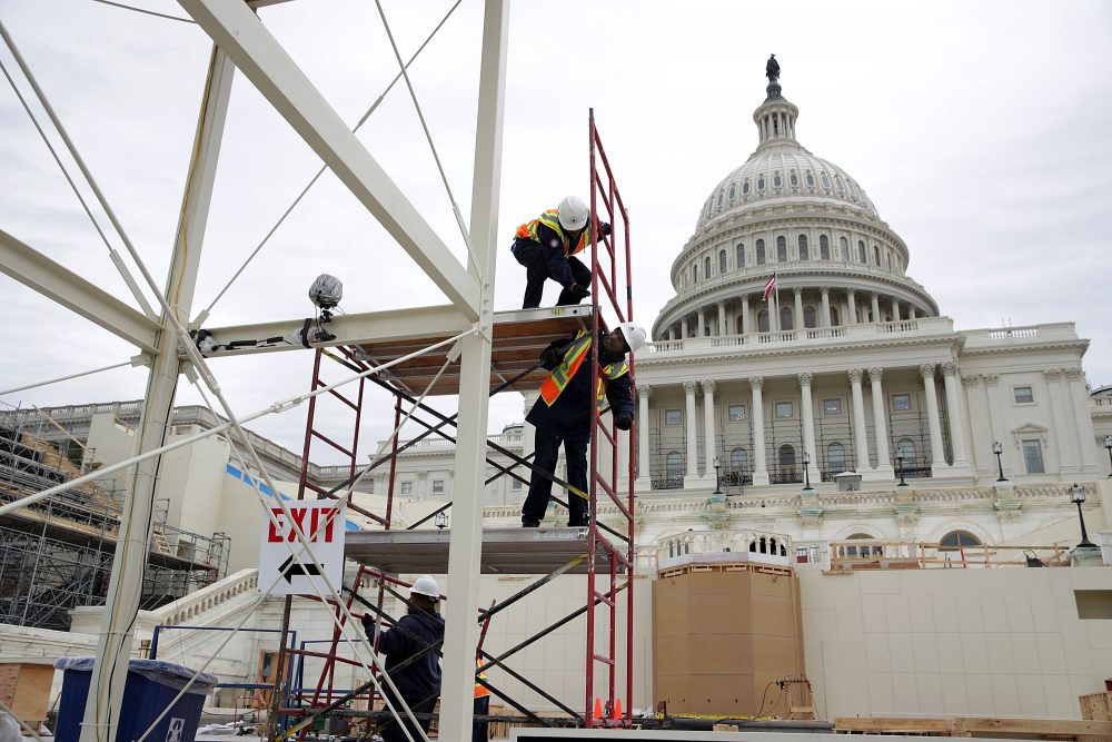 Employees of the Architect of the Capitol build a scaffolding at the West Front of the Capitol as construction of the 2017 presidential inaugural platform continues Dec. 8, 2016 on Capitol Hill in Washington, D.C. (Alex Wong/Getty Images)
