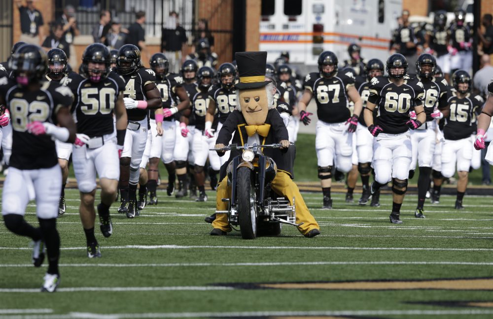 Wake Forest players take the field before a game against Syracuse in Winston-Salem, N.C., Saturday, Oct. 18, 2014. (Chuck Burton/AP)