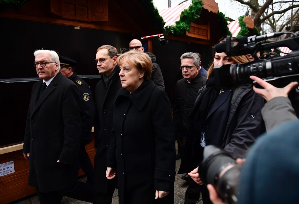 German Chancellor Angela Merkel (C), German Foreign Minister Frank-Walter Steinmeier (L), German Interior Minister Thomas de Maiziere (4thL) and Berlin's mayor Michael Mueller (2ndL) walk through the Christmas market of the Kaiser-Wilhelm-Gedaechtniskirche (Kaiser Wilhelm Memorial Church), the day after an attack at the nearby Christmas market in central Berlin, on Dec. 20, 2016. German police said they were treating as &quot;a probable terrorist attack&quot; the killing of 12 people when the speeding lorry cut a bloody swath through the packed Berlin Christmas market. (Tobias Schwarz/AFP/Getty Images)