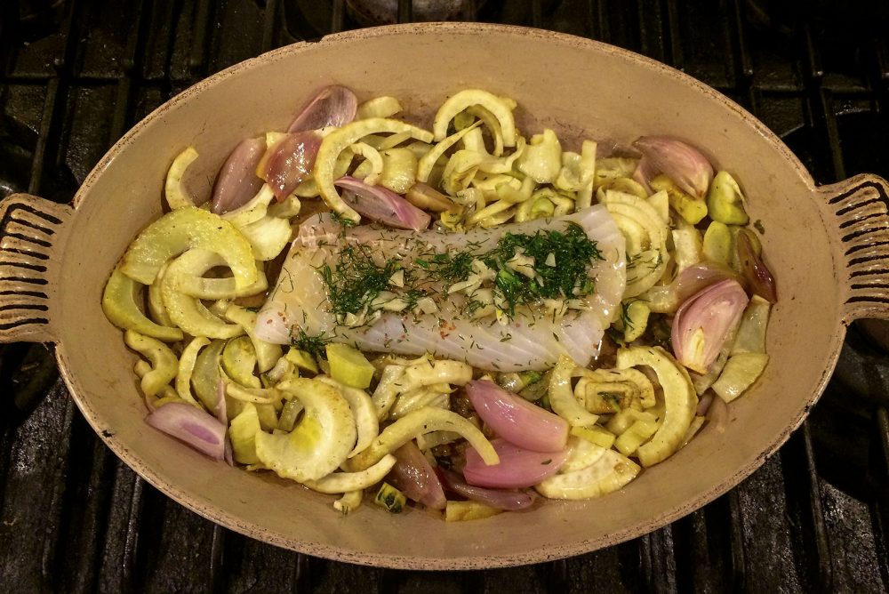 Kathy's roasted cod on a bed of roasted fennel and shallots. (Kathy Gunst for Here & Now)