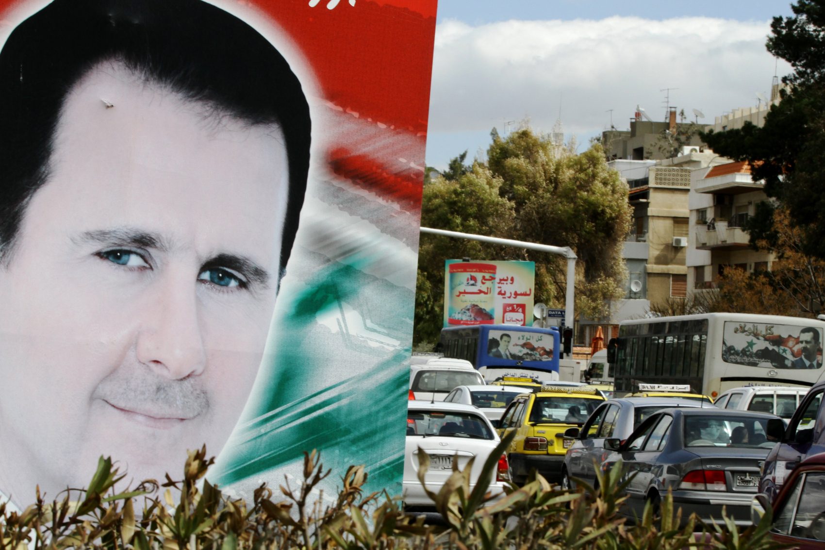 A banner bearing a portrait of Syrian President Bashar al-Assad in a street in the city of Damascus. (Louai Beshara/AFP/Getty Images)