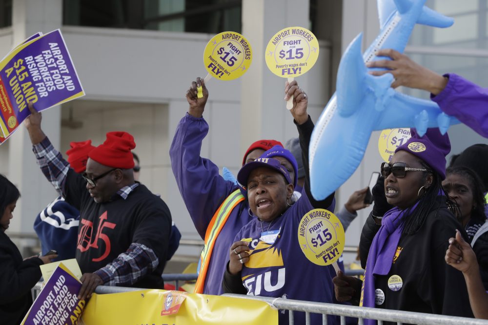 SEIU Local 1 union members protest for an increase in the minimum wage, Tuesday, Nov. 29, 2016, at the Detroit Metropolitan Airport in Romulus, Mich. (Carlos Osorio/AP)