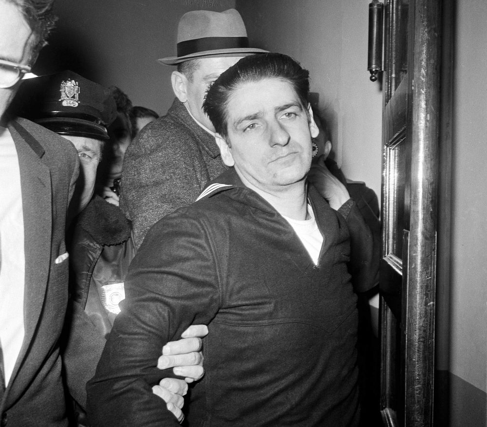 In this Feb. 25, 1967 black and white file photo, self-confessed Boston Strangler Albert DeSalvo is taken into custody after his capture north of Boston in Lynn, Mass. (Frank C. Curtin/AP)