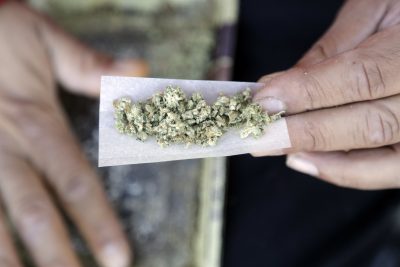 A marijuana joint is rolled last month in San Francisco. (Marcio Jose Sanchez/AP)