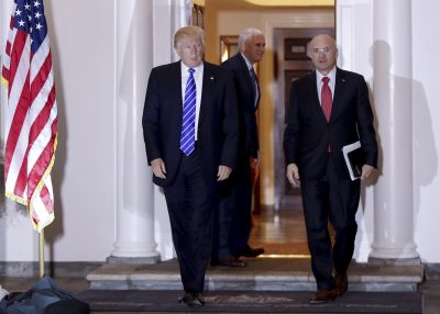  In this Nov. 19, 2016 file photo, President-elect Donald Trump walks with CKE Restaurants CEO Andy Puzder from Trump National Golf Club Bedminster clubhouse in Bedminster, N.J. Trump is expected to add another wealthy business person and elite donor to his Cabinet, with fast food executive Andrew Puzder as Labor secretary. In the background is Vice President-elect Mike Pence. (AP Photo/Carolyn Kaster)