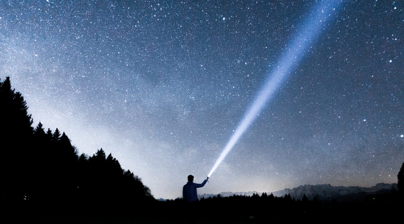 He doesn't really put the stars in the night sky, but, Bill Eville writes, while his children are far from home, he is still trying so hard to be their guiding light. (Martin Sattler/Unsplash)