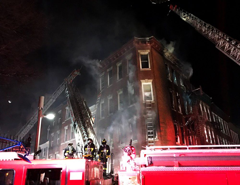 Firefighters battle a five-alarm fire on Christmas morning in the North End. (Boston Fire Department/Twitter)