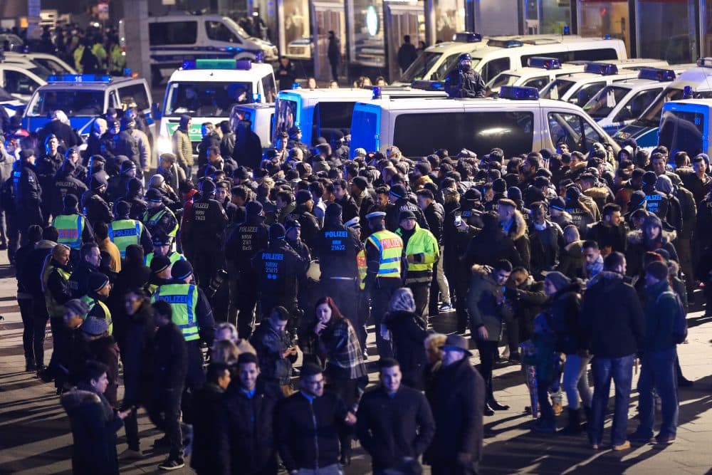 Police in Cologne, Germany hold a group of men in front of Hauptbahnhof main railway station. (Maja Hitij/Getty Images)