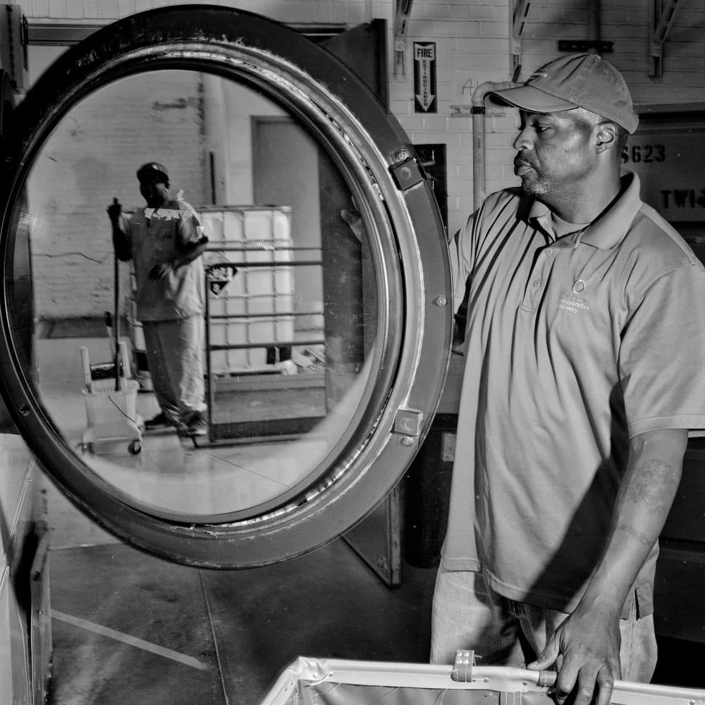 Chris Brown, working at the Evergreen Cooperative Laundry in Cleveland. He started out sweeping floors. Now he’s a supervisor. The worker-owned company is a bright spot in one of the neediest American cities, where nearly 40 percent of residents live in poverty. (Courtesy Matt Black/Magnum Photos via Smithsonian)