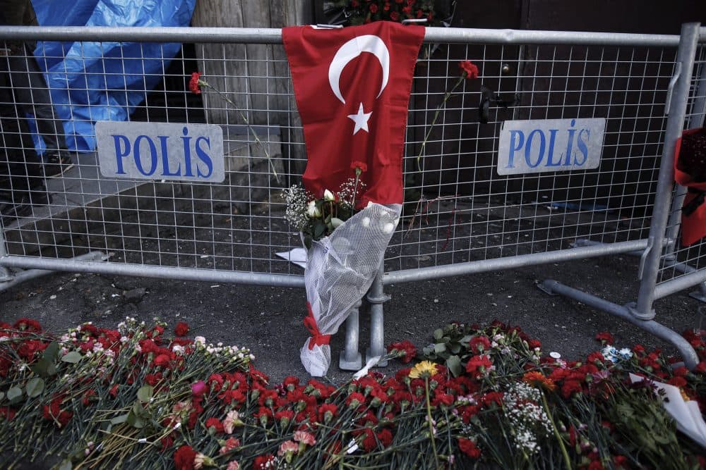 Carnations lay on the ground, near the scene, a day after an attack at a popular nightclub in Istanbul, Monday, Jan. 2, 2017. Turkey's state-run news agency says police have detained eight people in connection with the Istanbul nightclub attack. The gunman, who escaped after carrying out the attack, wasn't among the eight. The Islamic State group has claimed responsibility for the attack, which killed 39 people, most of them foreigners. (Halit Onur Sandal/AP)