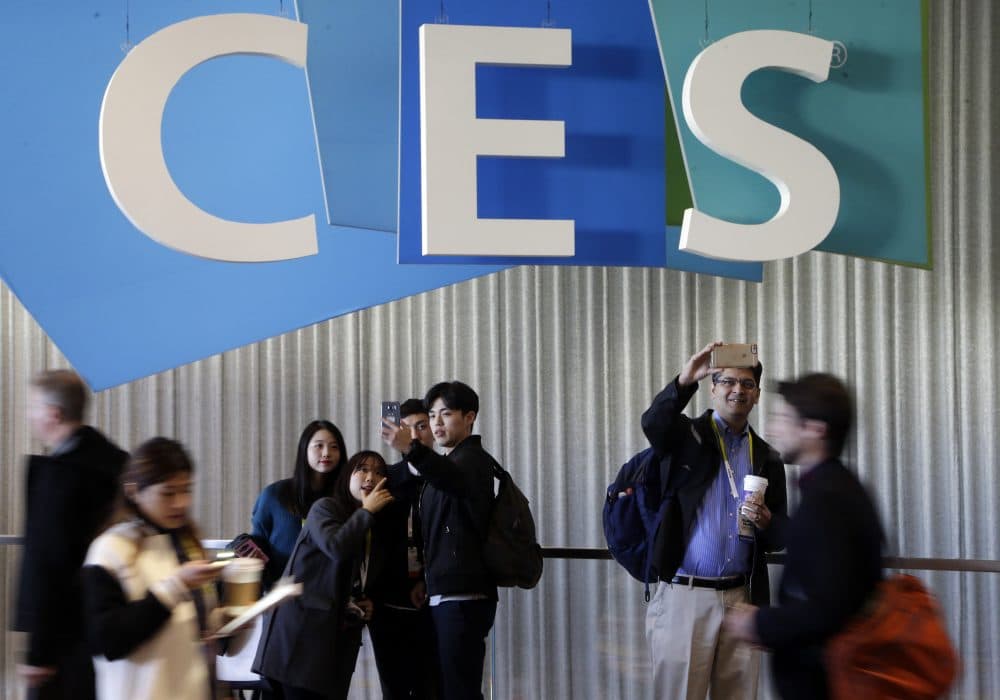 People take pictures in the halls at CES International, Thursday, Jan. 7, 2016, in Las Vegas. (Gregory Bull/AP)