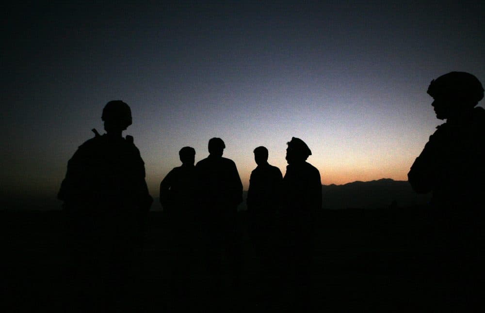 U.S. Army soldiers stand with Afghan policemen before a joint patrol of Qalanderkhail, outside of Bagram Air Field in Afghanistan in October 2009. (Maya Alleruzzo/AP)
