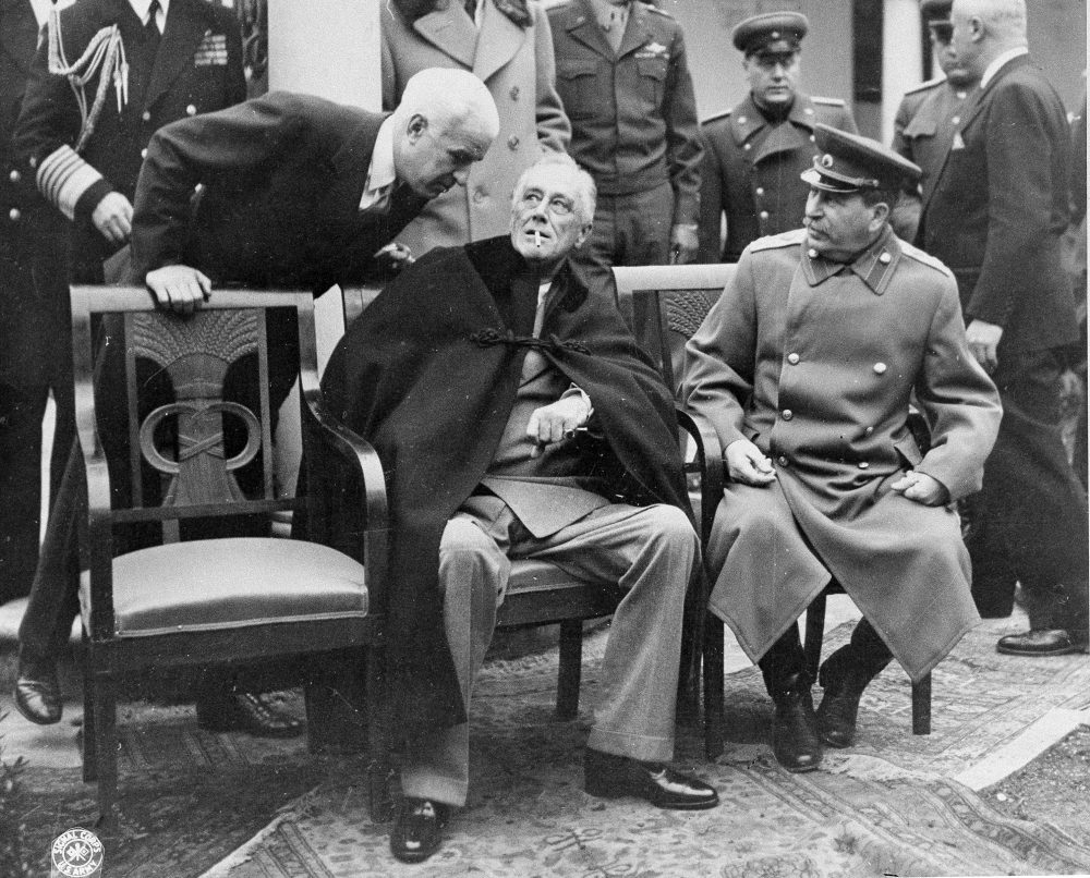 President Franklin D. Roosevelt, center, and Marshal Josef Stalin, right, at the Yalta Conference in Yalta, Crimea, on Feb. 16, 1945. (British Official Photo/AP)