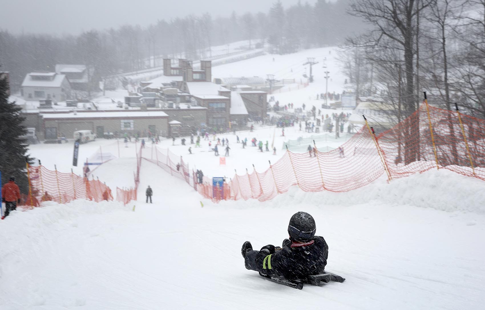 A young luger sets off down the slope at a USA Luge event at Wachusett Mountain. (Robin Lubbock/WBUR)