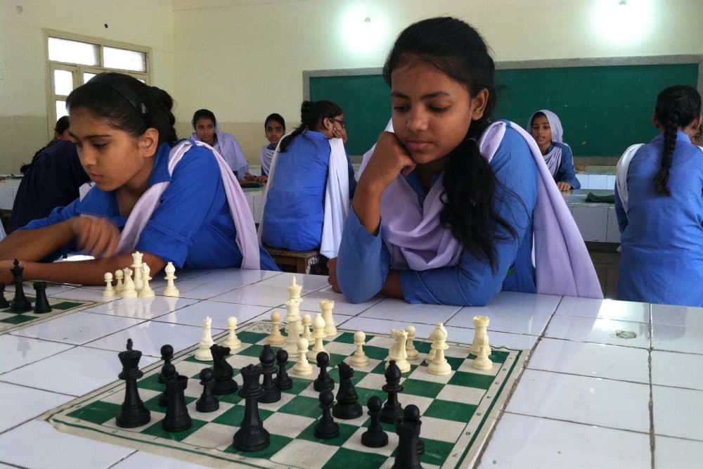 Girls study and compete in chess, just one of several extracurricular activities added to this girls’ public school since the Zindagi Trust adopted it in 2007. (Laura Isensee/Houston Public Media)