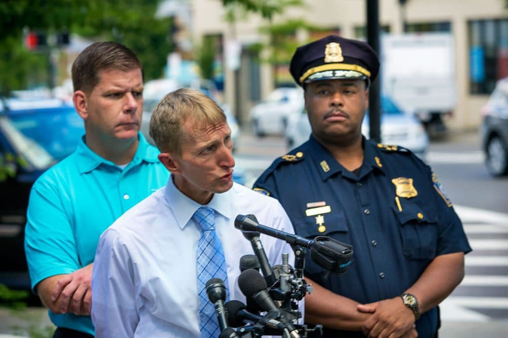 Boston Police Commissioner William Evans addresses city violence, with Mayor Marty Walsh, left, on Aug. 13. (Jesse Costa/WBUR)
