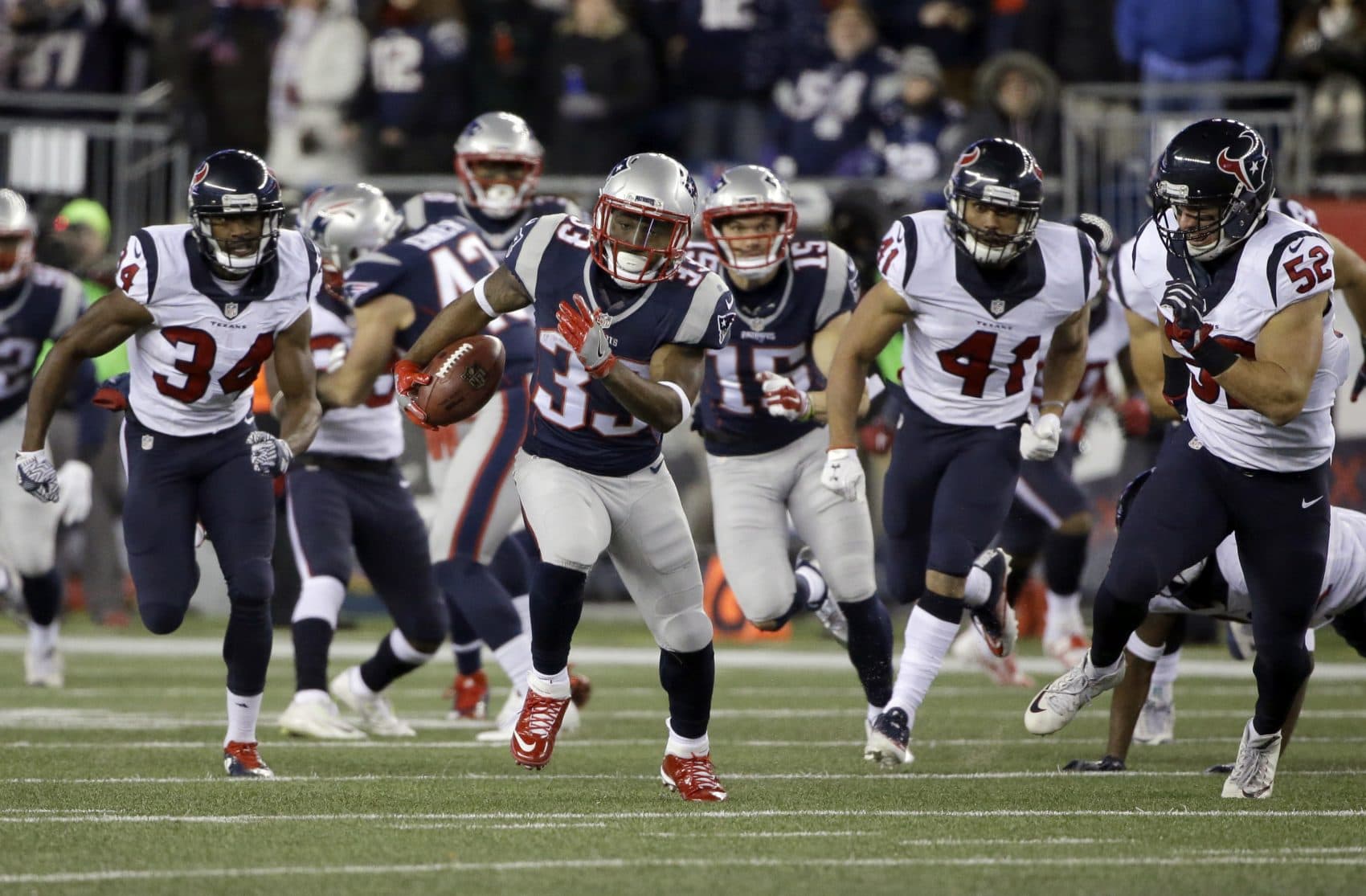 New England Patriots running back Dion Lewis runs for a touchdown against the Houston Texans during the first half of Saturday's AFC divisional playoff game at Gillette Stadium. (Elise Amendola/AP)