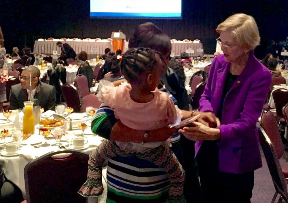 Sen. Elizabeth Warren talks with attendees of Boston's Martin Luther King Jr. Day breakfast Monday morning. (Shannon Dooling/WBUR)