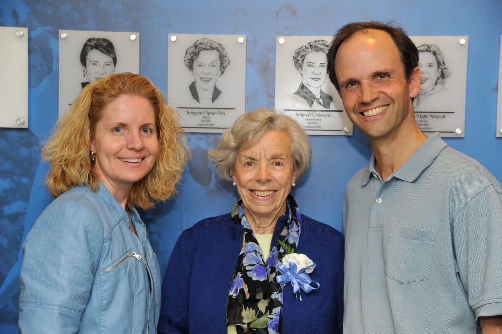 Mount Holyoke athletic director Lori Hendricks (left), Imogene Fish and associate professor of environmental studies Tim Farnham stand in front of Ms. Fish's plaque at the 2013 Mount Holyoke College Athletic Hall of Fame induction ceremony. (RJB Sports Photography)