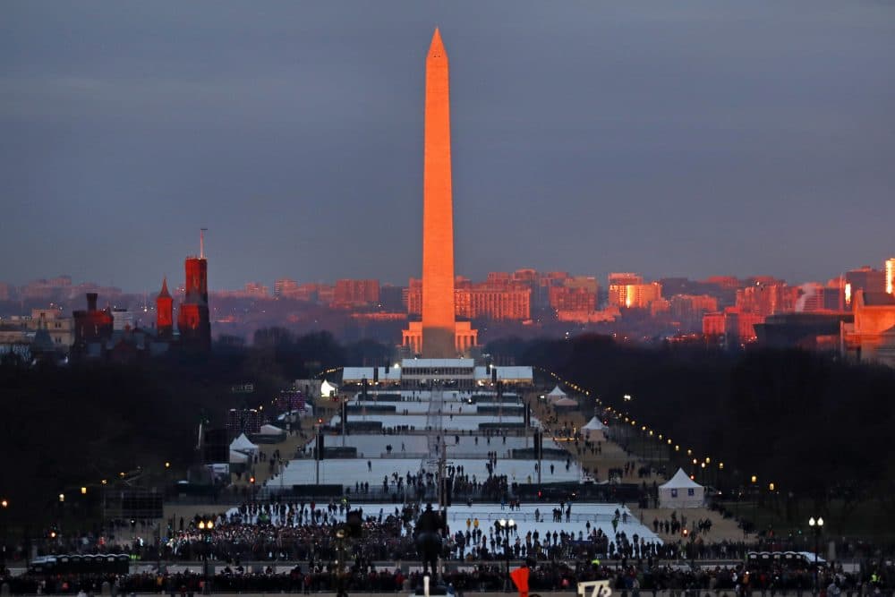 The crowd starts to fill the National Mall as the sun rises before the swearing in of Donald Trump as the 45th President of the Untied State during the 58th Presidential Inauguration at the U.S. Capitol in Washington, Friday. (Carolyn Kaster/AP)