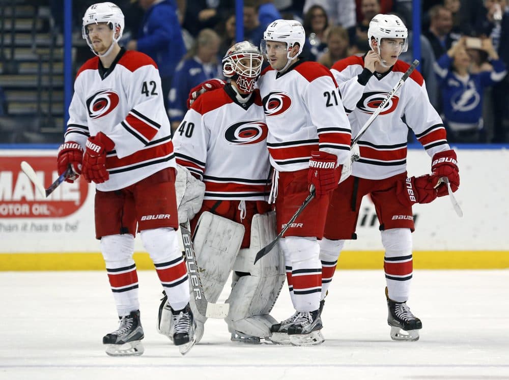 On New Year's Eve, Hurricanes equipment manager Jorge Alves served as the team's backup goalie -- and he played for 7.6 seconds. (Mike Carlson/AP)