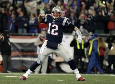 New England Patriots quarterback Tom Brady reacts after throwing a touchdown pass to Julian Edelman during the second half of the AFC championship game. (Matt Slocum/AP)