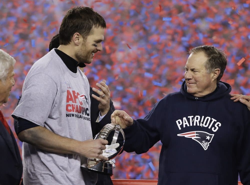 New England Patriots quarterback Tom Brady holds the AFC Championship trophy as he celebrates with head coach Bill Belichick after the AFC championship win against the Pittsburgh Steelers. (Matt Slocum/AP)