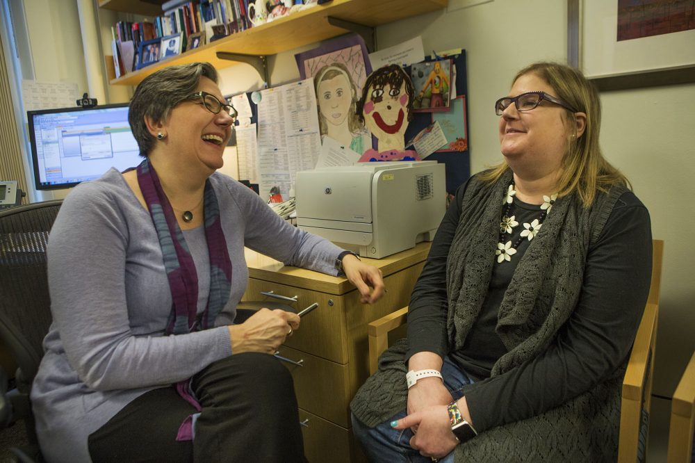 Dr. Vicki Jackson, left, the chief of palliative care at MGH, speaks with Lisa Geller. Immunotherapy helped rid Geller of her cancer. But because the long-term prognosis with these new medications is still not clear, even after going into remission patients can be on an emotional roller coaster. (Jesse Costa/WBUR)