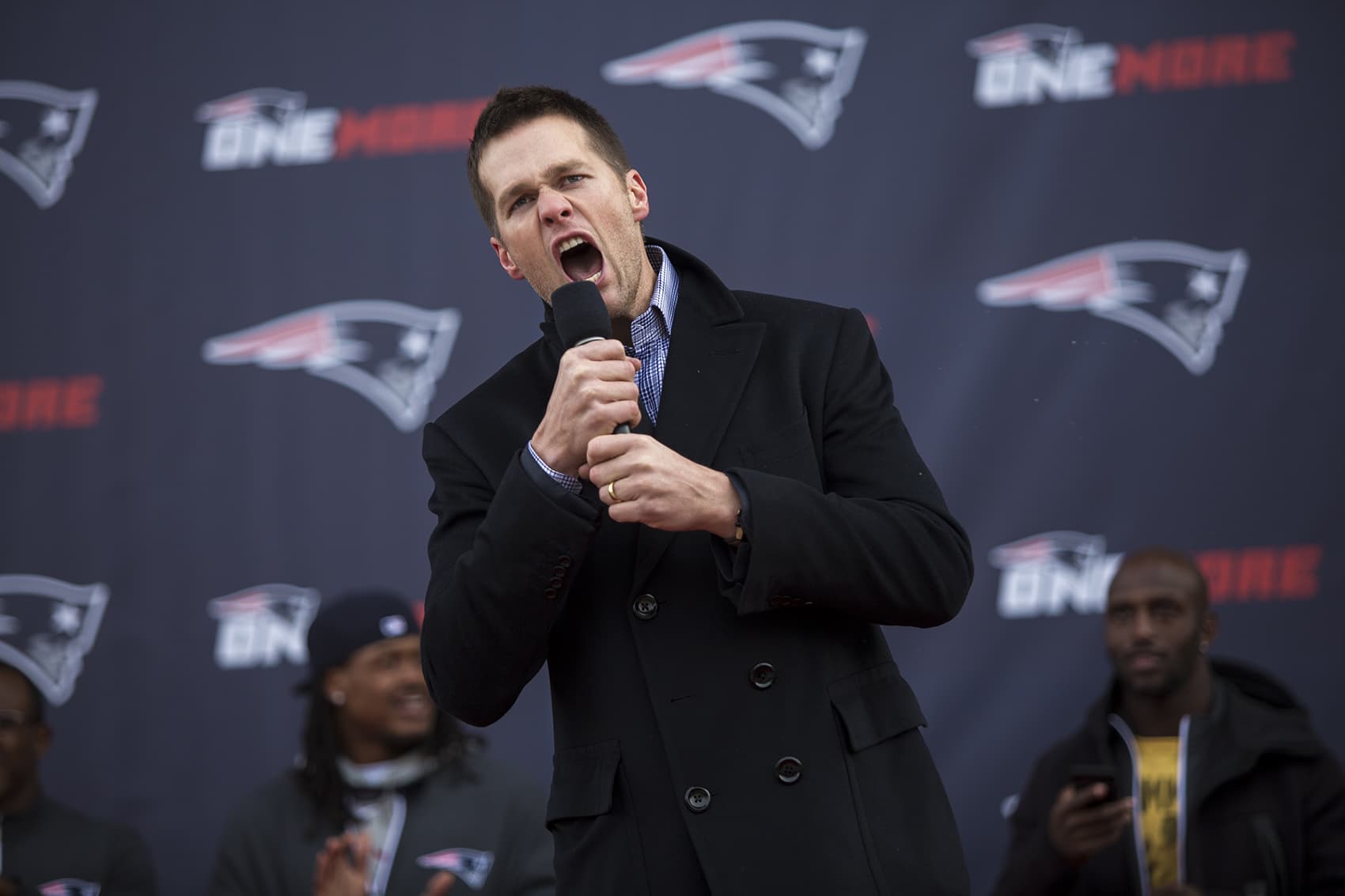 Tom Brady pumps up the crowd during the Patriots' Super Bowl sendoff in Foxborough. (Jesse Costa/WBUR)