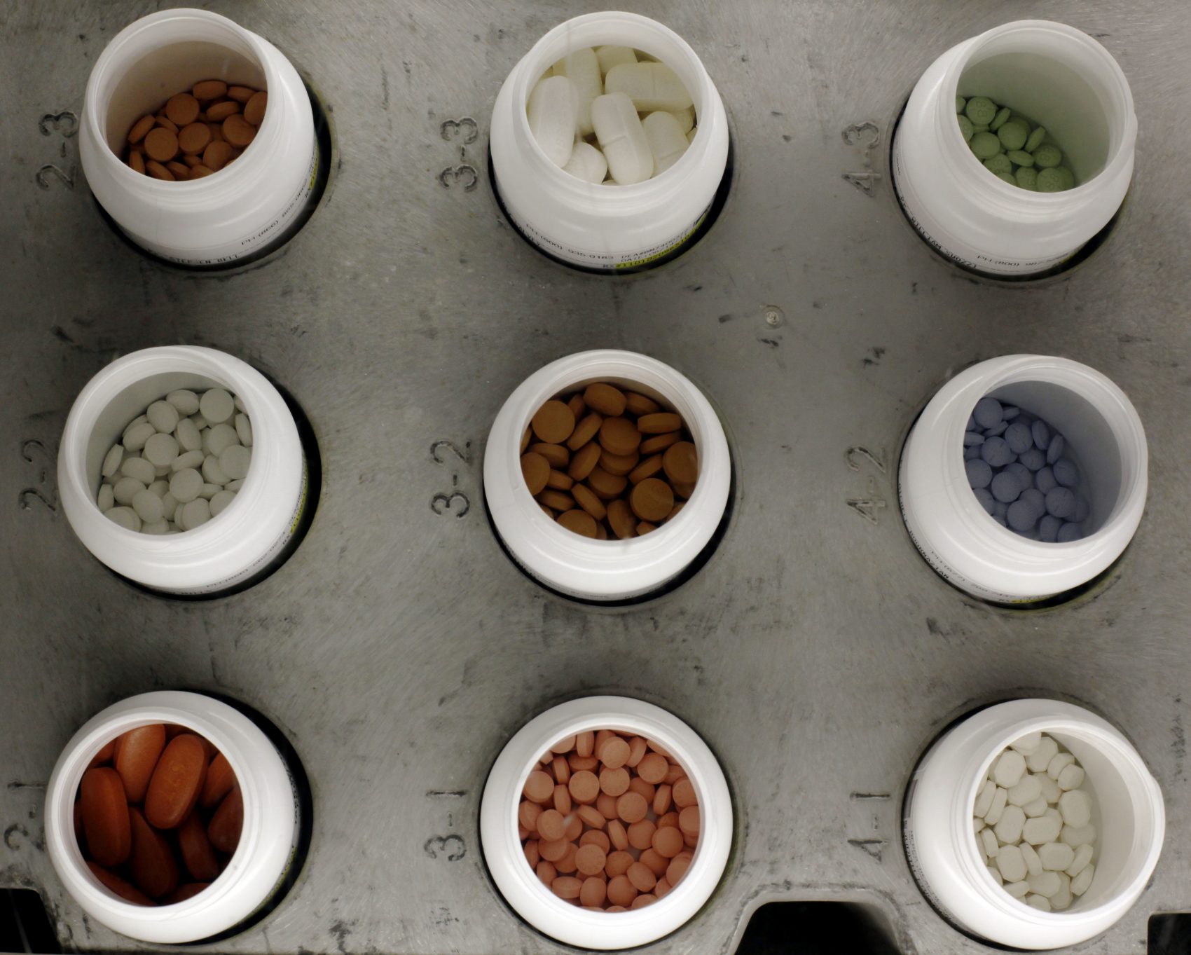 Various prescription drugs on the automated pharmacy assembly line at Medco Health Solutions in Willingboro, N.J. in 2011. (Matt Rourke/AP)