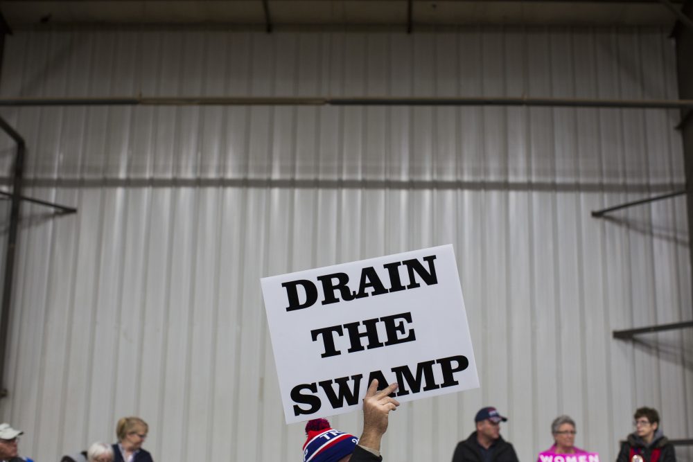 In this Oct. 27, 2016, file photo, supporters of then-Republican presidential candidate Donald Trump hold signs during a campaign rally in Springfield, Ohio. (Evan Vucci/AP)