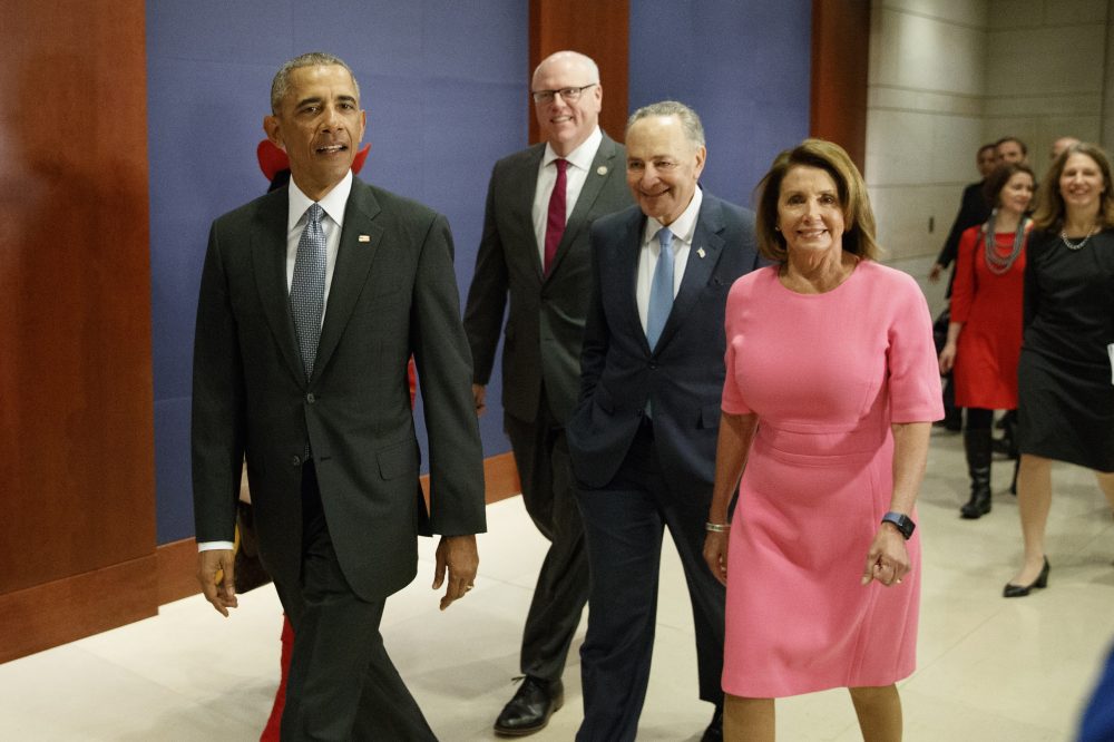 President Barack Obama, joined by, from second from left, Rep. Frederica Wilson, D-Fla., Rep. Joseph Crowley, D-N.Y., Senate Minority Leader Charles Schumer of N.Y., and House Minority Leader Nancy Pelosi of Calif. arrives on Capitol Hill in Washington, Wednesday, Jan. 4, 2017, to meet with members of Congress to discuss his signature healthcare law. (AP Photo/Evan Vucci)