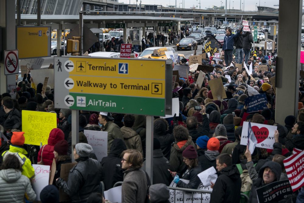 The most powerful denunciation, heard by writer Rich Barlow, of President Trump's refugee ban is 2,000 years old: St. Paul and Matthew's gospel. Protesters assemble at John F. Kennedy International Airport in New York, Saturday, Jan. 28, 2017 after two Iraqi refugees were detained while trying to enter the country. On Friday, Jan. 27, President Donald Trump signed an executive order suspending all immigration from seven countries with terrorism concerns for 90 days. (Craig Ruttle/AP)