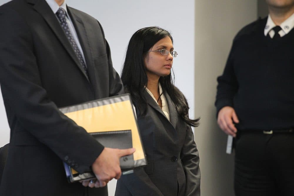 Former state lab chemist Annie Dookhan, center, stands in Middlesex Superior Court for arraignment in 2013. (Suzanne Kreiter/The Boston Globe, Pool via AP)