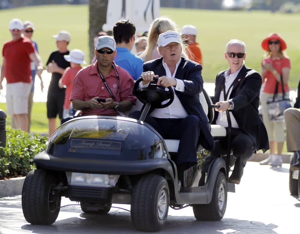 Any foreign money Trump receives, in any form, could violate the Constitution’s emoluments clause -- which prohibits government officials from taking money or gifts from a foreign state -- as alleged in the lawsuit filed last week by a group of ethics experts and legal scholars. In this March 6, 2016, file photo, Republican presidential candidate Donald Trump, right, drives himself around the golf course to watch the final round of the Cadillac Championship golf tournament in Doral, Fla. (Luis Alvarez/AP)