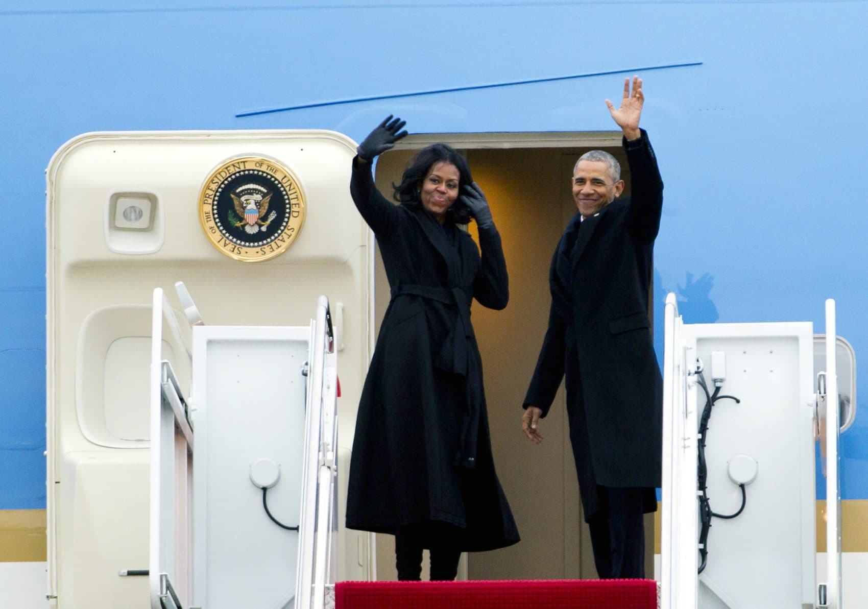 The First Lady’s platform, writes Joanna Weiss, has become increasingly powerful, a way to move markets, change minds, and set a standard for a nation full of girls.
Pictured: President Barack Obama and First Lady Michelle Obama wave from Air Force One at Andrews Air Force Base, Md., Tuesday, Jan. 10, 2017.  (Jose Luis Magana/AP)