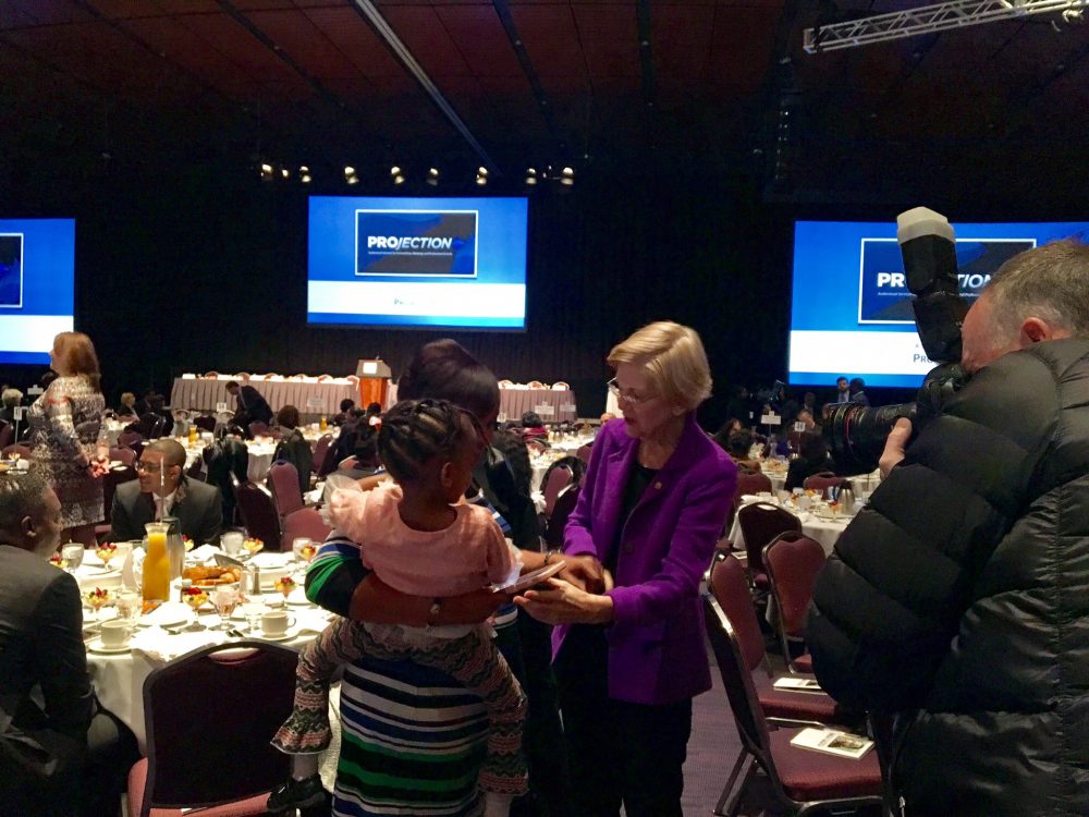 Sen. Elizabeth Warren talks with attendees of Boston's 47th annual MLK Memorial breakfast Monday morning. (Shannon Dooling/WBUR)