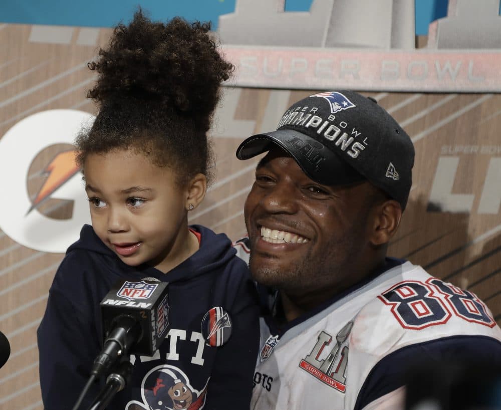 New England Patriots' Martellus Bennett appears at a news conference with his daughter Austyn Jett Rose Bennett after Super Bowl LI on Sunday. (Chuck Burton/AP)