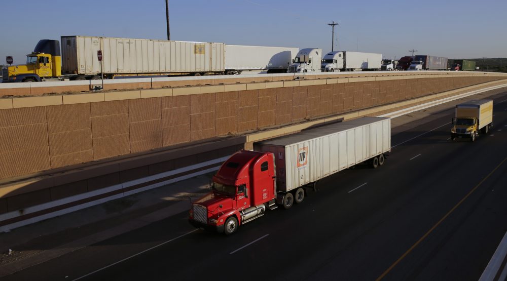 Trucks move along Interstate 35, in Laredo, Texas, in November 2016. President Trump’s campaign promise to abandon the North American Free Trade Agreement helped win over Rust Belt voters who felt left behind by globalization. But the idea is unnerving to many people in cities on the U.S.-Mexico border. (Eric Gay/AP)