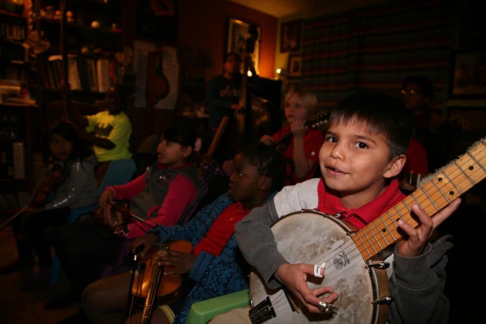 The Jam Pak Blues 'N' Grass Neighborhood Band has been making music together since 1994. So far, about 200 kids have gone through the band, though many never really leave, even when they grow up. (Stina Sieg/KJZZ)