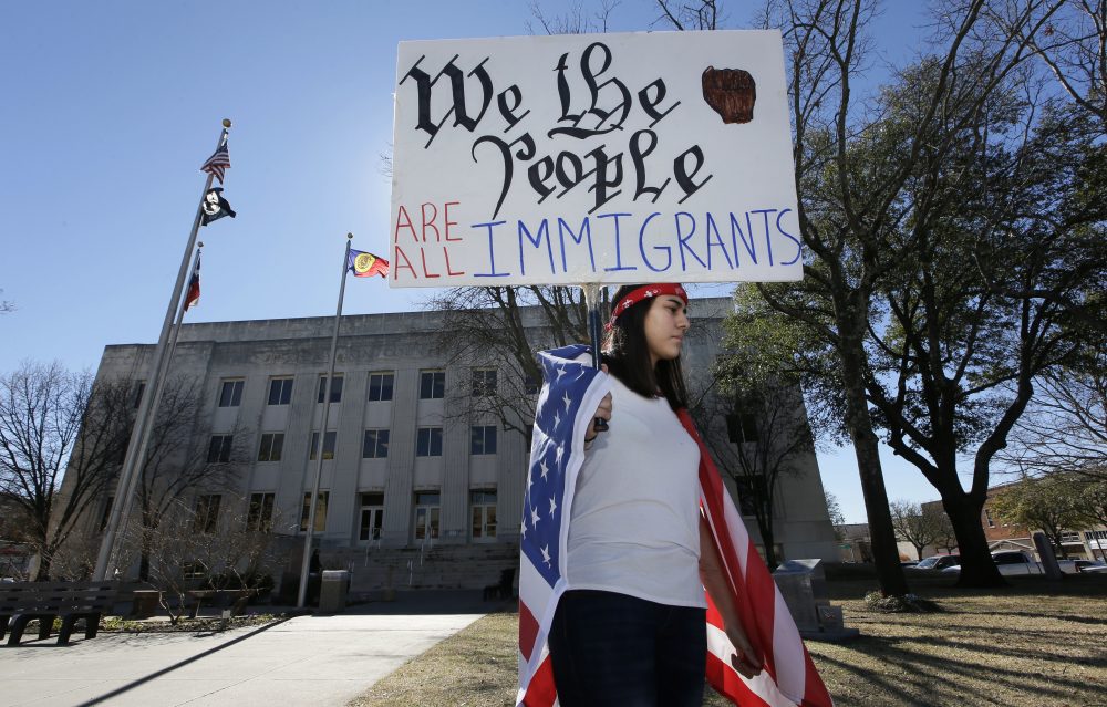 High school senior Vicky Sosa holds a sign outside the Grayson County courthouse in downtown Sherman, Texas, Thursday, Feb. 16, 2017. In an action called &quot;A Day Without Immigrants,&quot; immigrants across the country are expected to stay home from school, work and close businesses to show how critical they are to the U.S. economy and way of life. (LM Otero/AP)