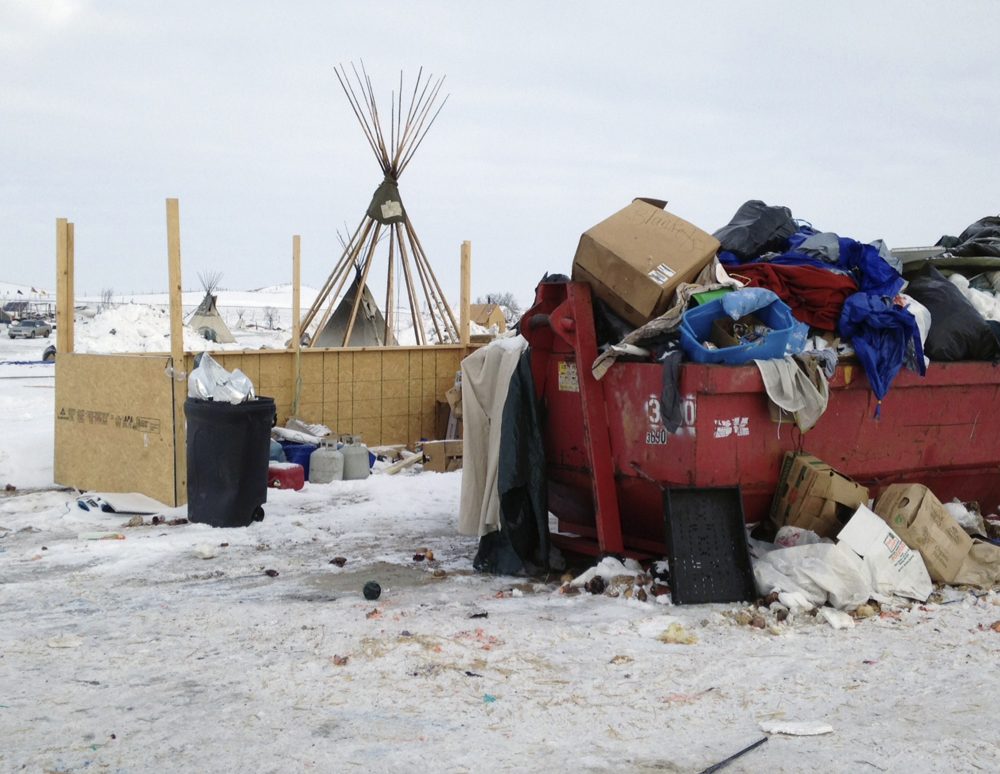 Trash is seen piled in a dumpster at an encampment set up near Cannon Ball, N.D., Wednesday, Feb. 8, 2017, for opponents against the construction of the Dakota Access pipeline. (James MacPherson/AP)