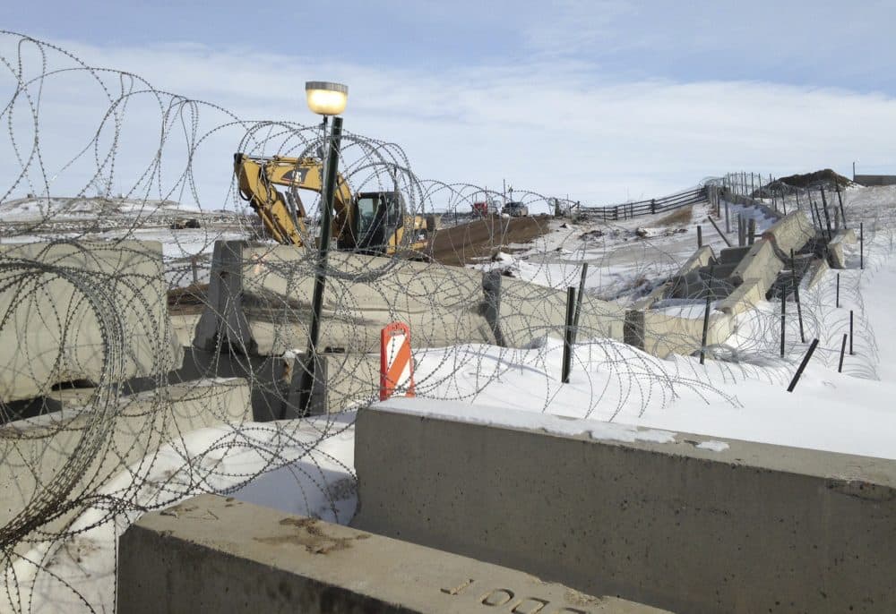 Razor wire and concrete barriers protect access to the Dakota Access pipeline drilling site Thursday, Feb. 9, 2017 near Cannon Ball, North Dakota. (James MacPherson/AP)