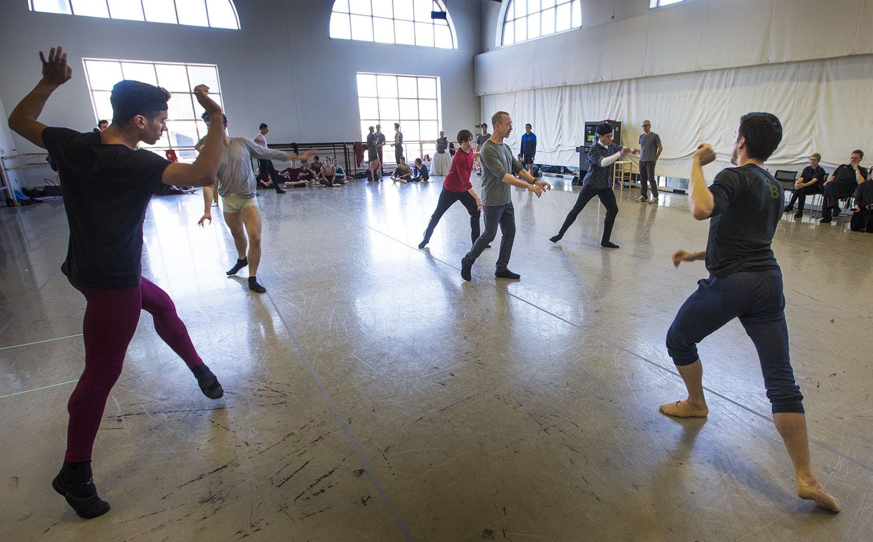 Forsythe guides the dancers through a rehearsal. (Jesse Costa/WBUR)